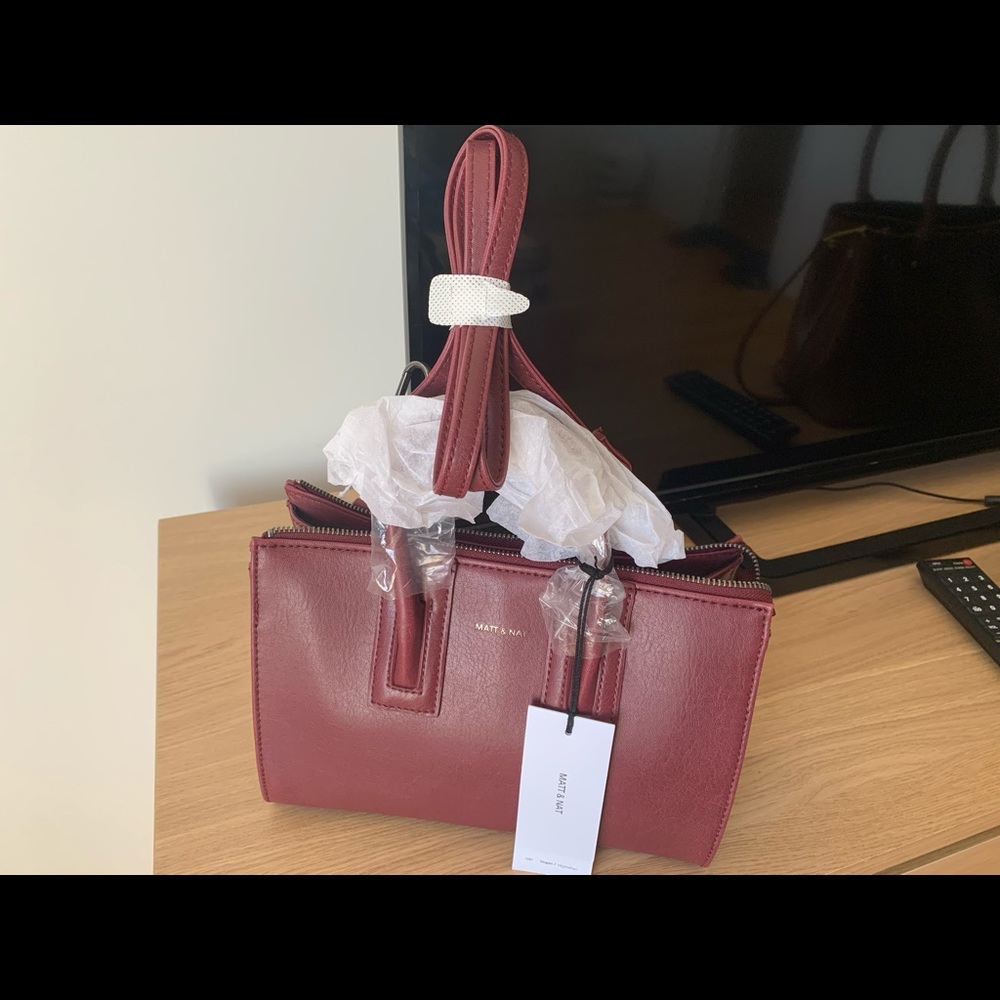Matt and nat , deep cherry bag